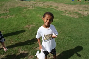 Camper enjoying cotton candy at Eagles Landing